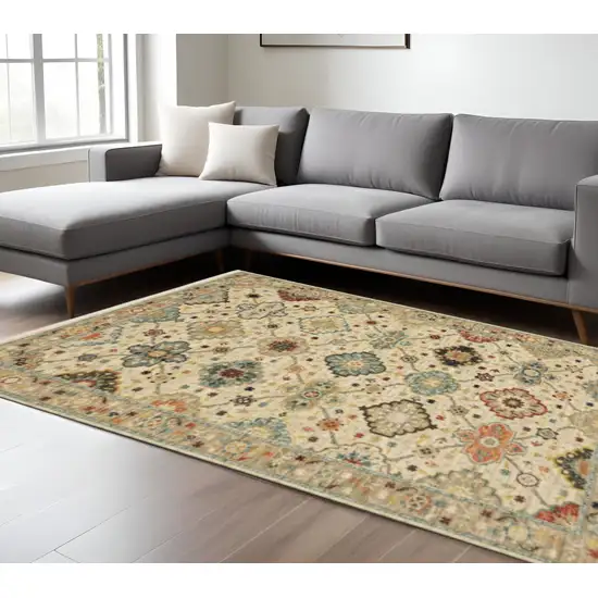 6' X 9' Beige Pale Blue Rust Gold Tan Brown And Orange Oriental Power Loom Stain Resistant Area Rug With Fringe Photo 1