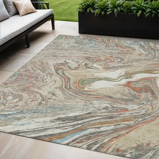 Beige Pink And Blue Abstract Washable Indoor Outdoor Area Rug Photo 1