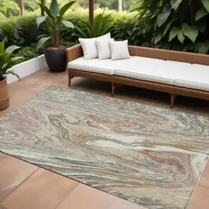 Photo of Beige Pink And Blue Abstract Washable Indoor Outdoor Area Rug
