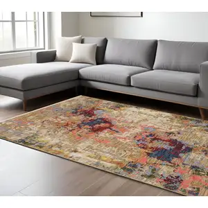 Photo of Beige Salmon And Tan Abstract Area Rug With Fringe
