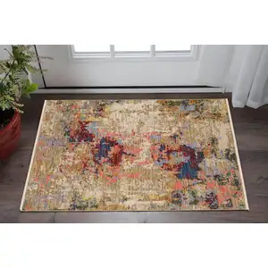 Photo of Beige Salmon And Yellow Abstract Area Rug With Fringe