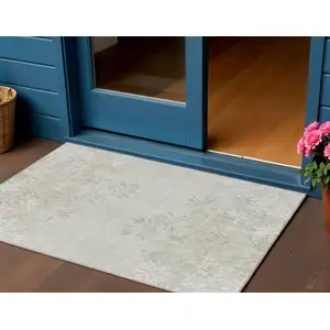 Photo of Beige Tan And Ivory Floral Washable Indoor Outdoor Area Rug