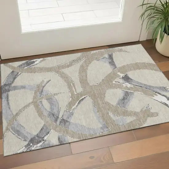 Beige Taupe And Gray Abstract Washable Area Rug With UV Protection Photo 1