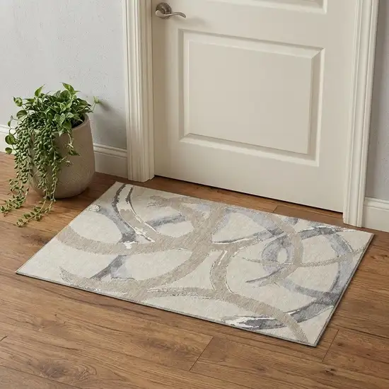 Beige Taupe And Gray Abstract Washable Area Rug With UV Protection Photo 1