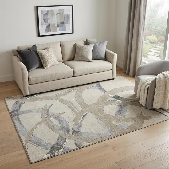 Beige Taupe And Gray Abstract Washable Area Rug With UV Protection Photo 1