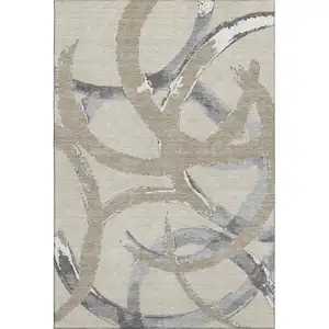 Photo of Beige Taupe And Gray Abstract Washable Area Rug With UV Protection