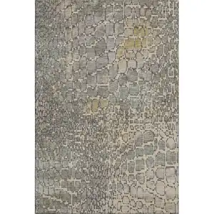 Photo of Beige Taupe And Ivory Abstract Geometric Washable Area Rug With UV Protection