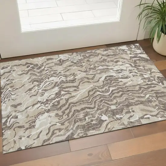 Beige Taupe And Ivory Abstract Washable Area Rug With UV Protection Photo 1