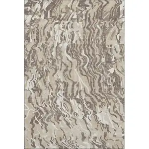 Photo of Beige Taupe And Ivory Abstract Washable Area Rug With UV Protection