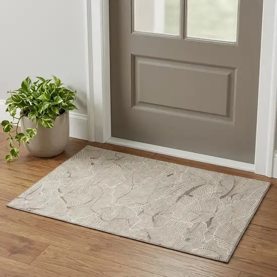 Beige Taupe And Ivory Abstract Washable Area Rug With UV Protection Photo 1