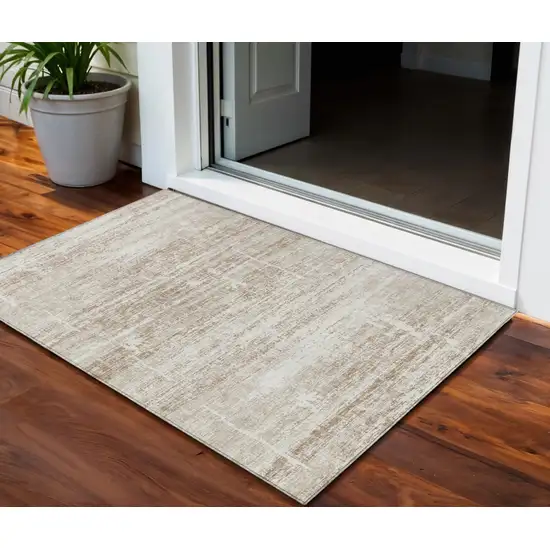 Beige Taupe And Ivory Abstract Washable Indoor Outdoor Area Rug Photo 1