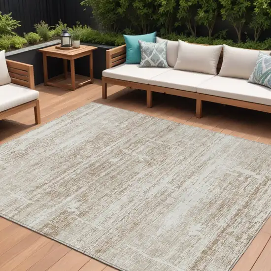 Beige Taupe And Ivory Abstract Washable Indoor Outdoor Area Rug Photo 1