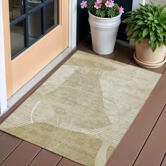 Beige Taupe And Tan Abstract Washable Indoor Outdoor Area Rug Photo 1