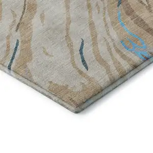 Photo of Beige Teal And Brown Abstract Washable Area Rug With UV Protection