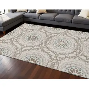 Photo of Beige Teal And Brown Geometric Washable Area Rug With UV Protection