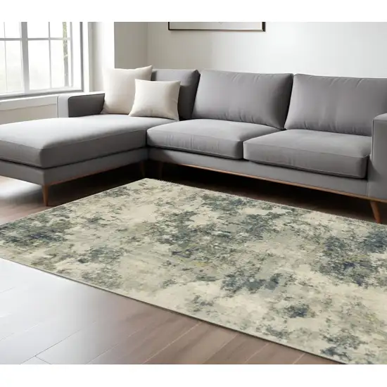 Beige And Ivory Abstract Area Rug Photo 1