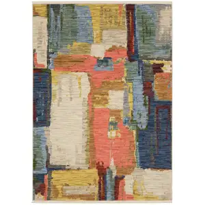 Photo of Beige Yellow And Salmon Abstract Area Rug With Fringe