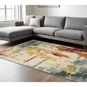 Photo of Beige Yellow And Salmon Abstract Area Rug With Fringe
