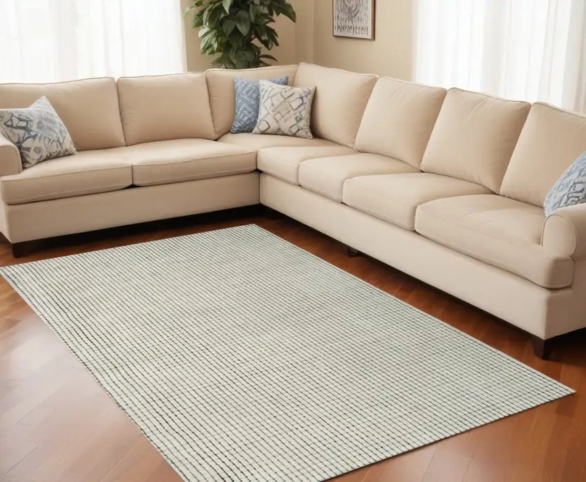 Beige and Black Checkered Power Loom Distressed Area Rug Photo 1