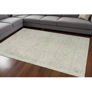 Photo of Beige and Black Checkered Power Loom Distressed Area Rug