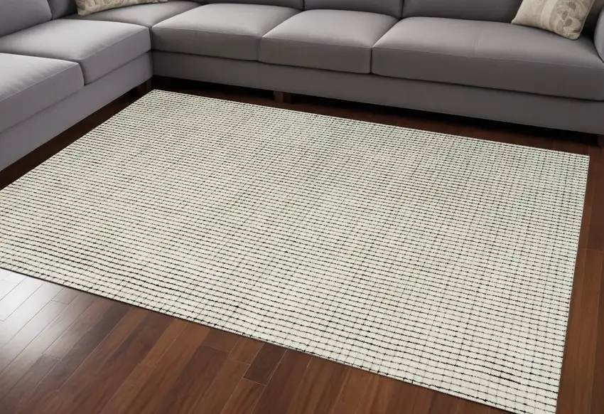 Beige and Black Checkered Power Loom Distressed Area Rug Photo 1