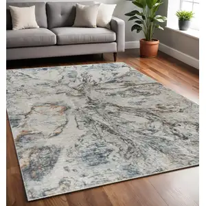 Photo of Beige and Blue Abstract Power Loom Area Rug