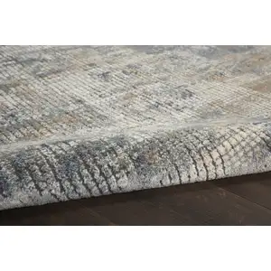 Photo of Beige and Blue Abstract Power Loom Distressed Area Rug