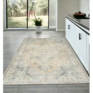 Photo of Beige and Blue Floral Medallion Power Loom Distressed Washable Area Rug