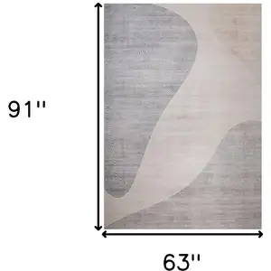 Photo of Beige and Brown Abstract Distressed Area Rug