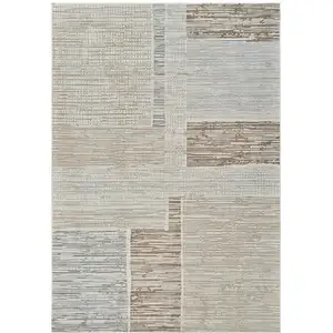 Photo of Beige and Brown Abstract Distressed Area Rug