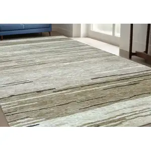 Photo of Beige and Brown Abstract Power Loom Distressed Area Rug