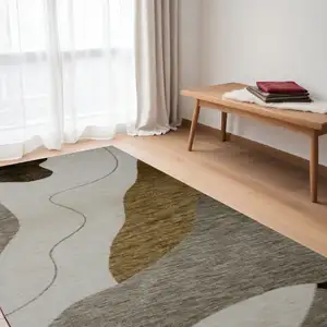 Photo of Beige and Brown Abstract Power Loom Distressed Area Rug