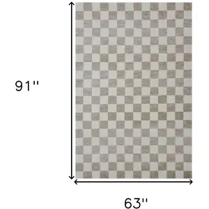 Photo of Beige and Brown Checkered Power Loom Area Rug
