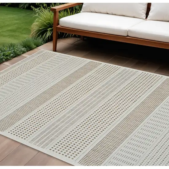 Beige and Brown Geometric Distressed Indoor Outdoor Area Rug Photo 1