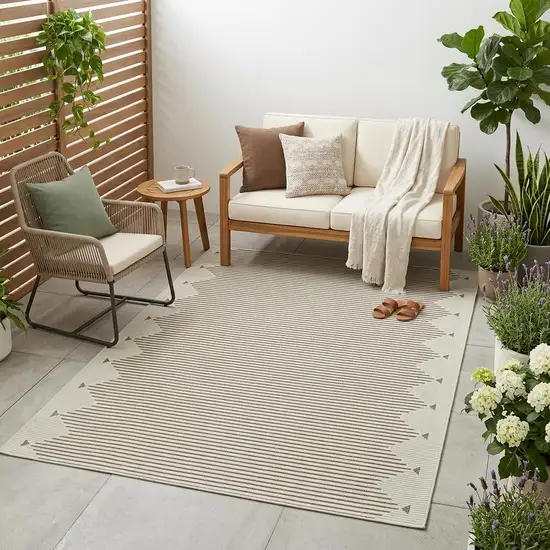 Beige And Brown Geometric Distressed Indoor Outdoor Area Rug Photo 1