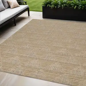 Photo of Beige and Brown Geometric Distressed Indoor Outdoor Area Rug