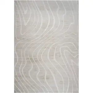 Photo of Beige and Ivory Abstract Distressed Area Rug