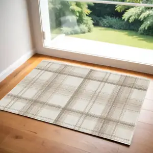 Photo of Beige and Ivory Plaid Power Loom Area Rug