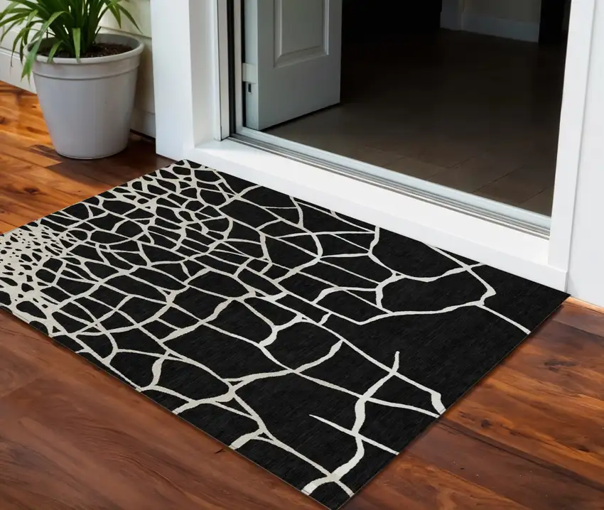 Black And Beige Abstract Washable Indoor Outdoor Area Rug Photo 1