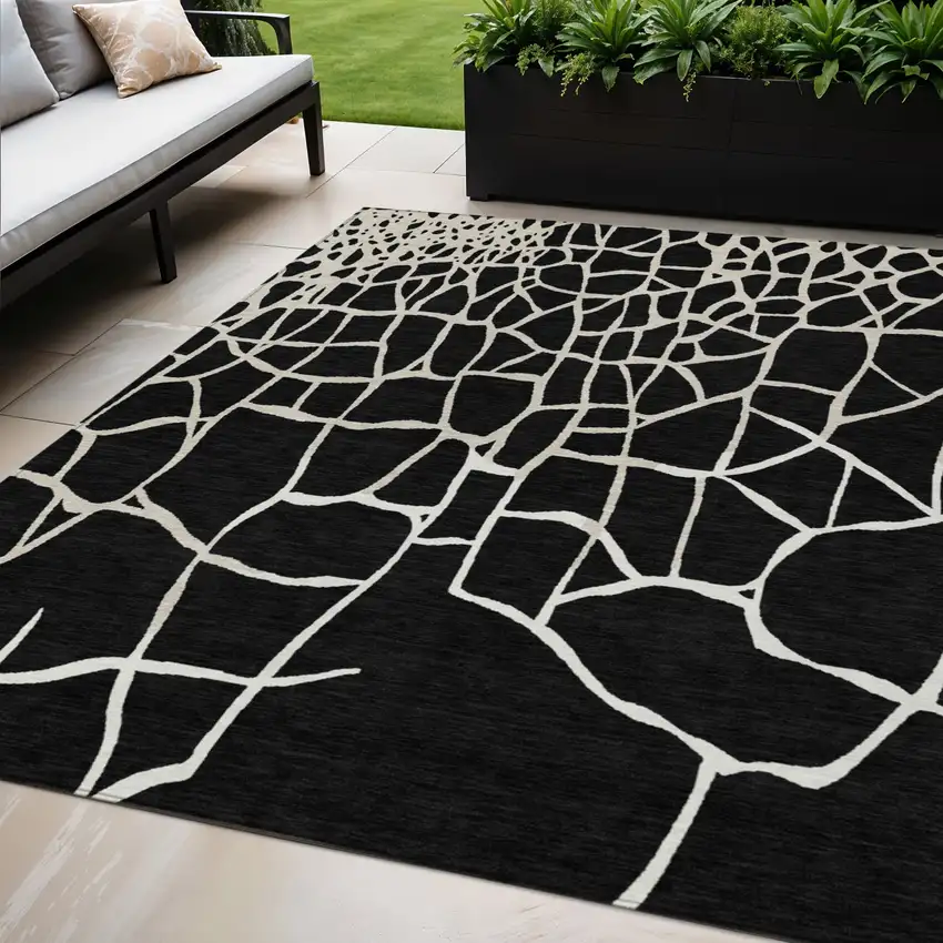 Black And Beige Abstract Washable Indoor Outdoor Area Rug Photo 1