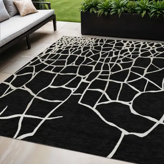 Black And Beige Abstract Washable Indoor Outdoor Area Rug Photo 1