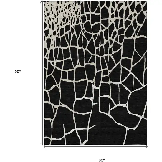 Black And Beige Abstract Washable Indoor Outdoor Area Rug Photo 8