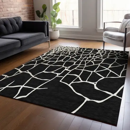 Black And Beige Abstract Washable Indoor Outdoor Area Rug Photo 9