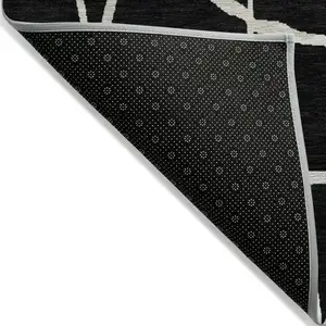 Photo of Black And Beige Abstract Washable Indoor Outdoor Area Rug