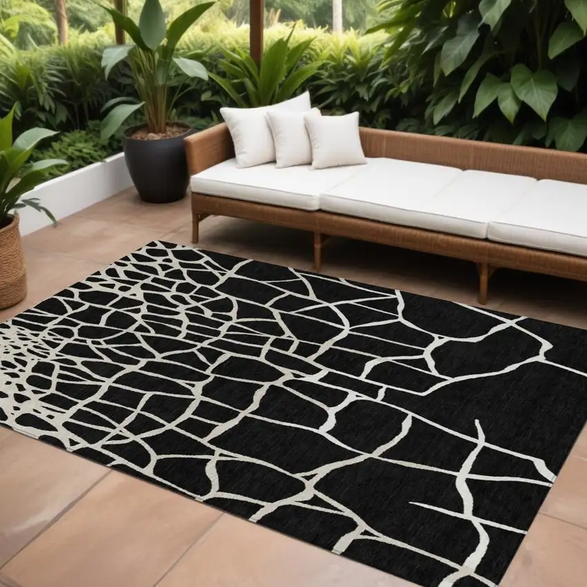 Black And Beige Abstract Washable Indoor Outdoor Area Rug Photo 1