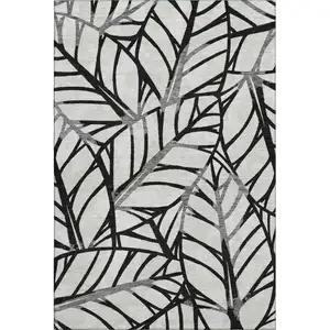 Photo of Black And Beige Floral Washable Area Rug With UV Protection