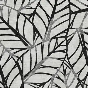 Photo of Black And Beige Floral Washable Area Rug With UV Protection