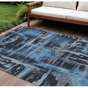 Photo of Black And Blue Abstract Washable Indoor Outdoor Area Rug