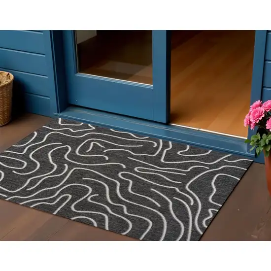 Black And Cream Abstract Indoor Outdoor Area Rug Photo 1