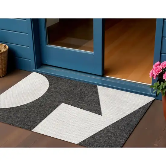 Black And Cream Geometric Indoor Outdoor Area Rug Photo 1